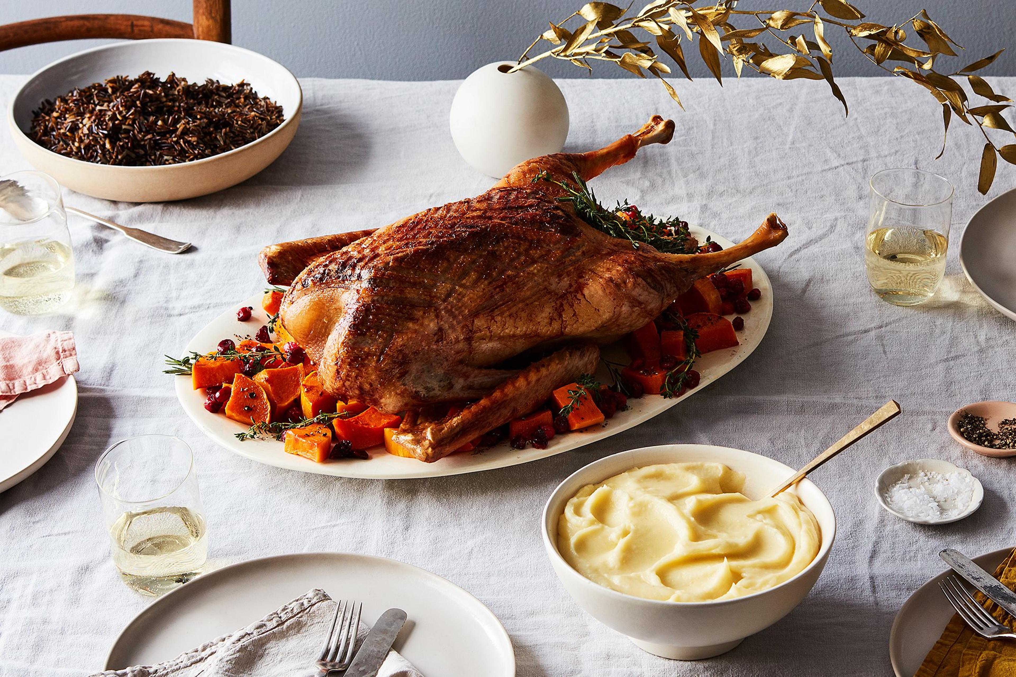 classic roast goose and potatoes on Christmas dinner table